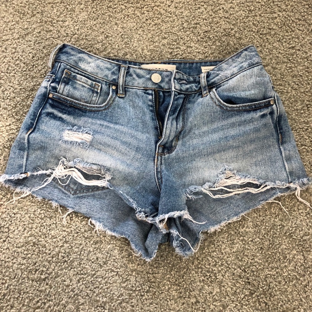 blue ripped jean shorts